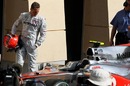 Michael Schumacher inspects a McLaren in parc ferme
