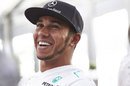 Lewis Hamilton laughs during a media interview