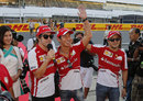 Ferrari's Fernando Alonso and Felipe Massa take Kamui Kobayashi out to meet the fans