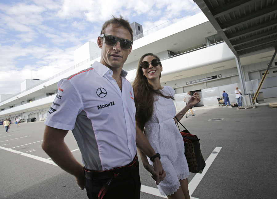 Jenson Button leaves the circuit with girlfriend Jessica Michibata