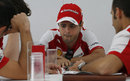 Felipe Massa in discussion with his Ferrari engineers