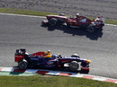 Sebastian Vettel passes the spinning Fernando Alonso