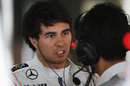 Sergio Perez talks to one of his McLaren engineers