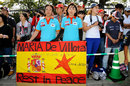 Fans with a flag for Maria de Villota at the entrance to the circuit