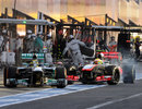 Sergio Perez takes avoiding action as Nico Rosberg is released into his path in the pits
