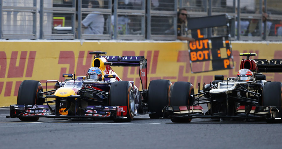 Sebastian Vettel finds his way past Romain Grosjean