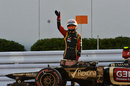 Romain Grosjean waves to the crowd after stopping on track after the race