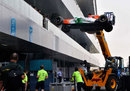 A Force India is lifted in to place in the paddock