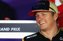 Kimi Raikkonen laughs during the driver press conference