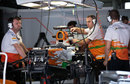 Force India mechanics work on Paul di Resta's car