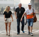 Adrian Sutil arrives at the circuit with girlfriend Jennifer Becks on Friday morning