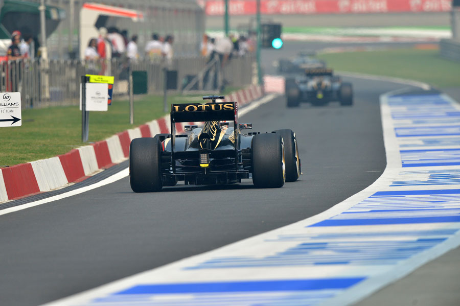 Kimi Raikkonen heads down the pit lane