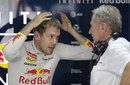 Sebastian Vettel jokes with Helmut Marko in the back of the garage