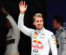 Sebastian Vettel waves to the crowds after taking pole position