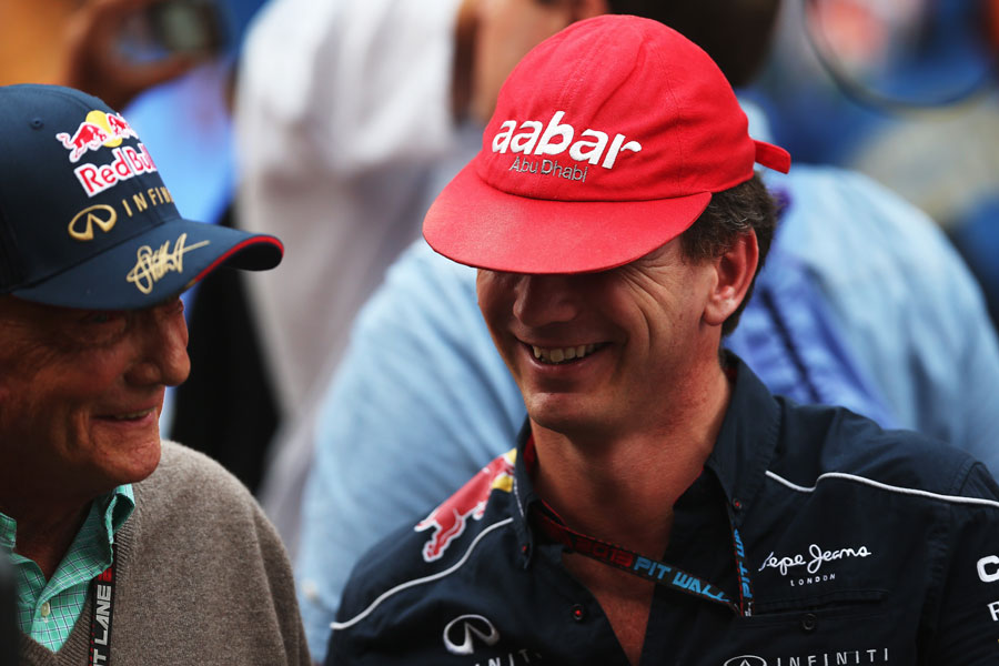 Niki Lauda and Christian Horner swap caps after the race