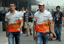 The two Force India drivers walk through the paddock