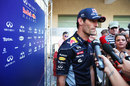Mark Webber faces the media in the paddock