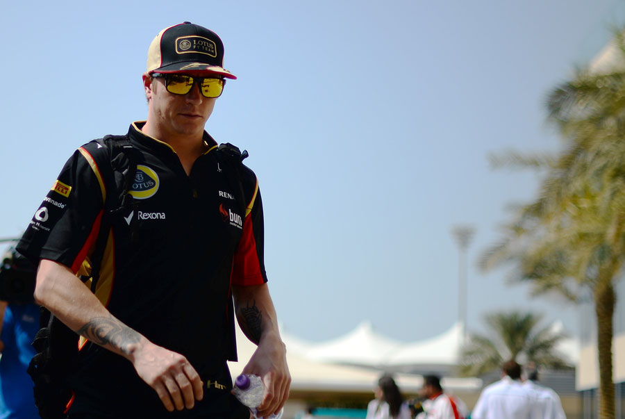 Kimi Raikkonen arrives in the paddock on Friday after skipping Thursday's media day
