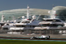 Nico Rosberg speeds past yachts in the marina