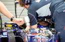 Mark Webber gets strapped in to his Red Bull