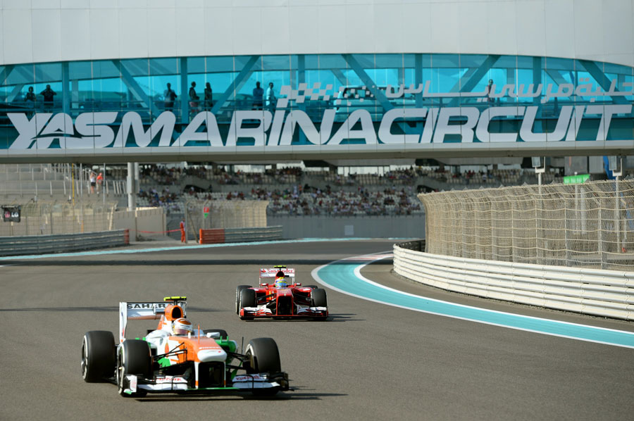 Adrian Sutil leads Felipe Massa
