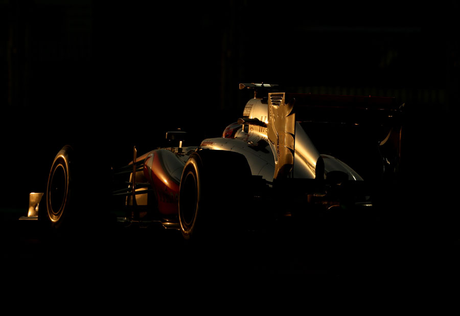 Jenson Button on a qualifying lap as the sun sets