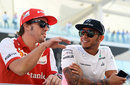 Fernando Alonso and Lewis Hamilton chat on the drivers' parade