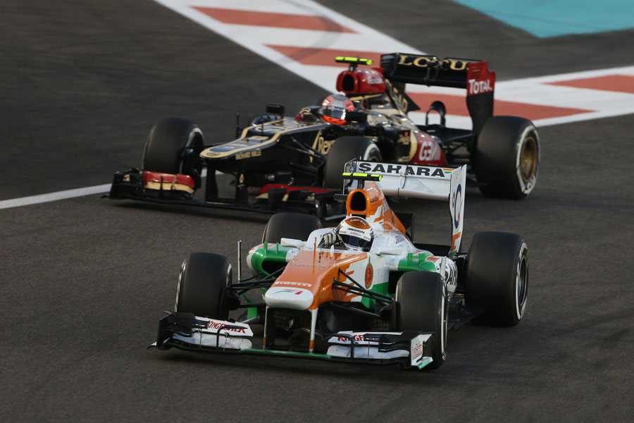 Adrian Sutil holds off Romain Grosjean in to the hairpin