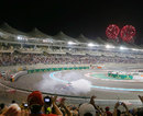 Sebastian Vettel entertains the fans as fireworks mark his victory