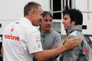 Martin Whitmarsh jokes with Sergio Perez in the paddock