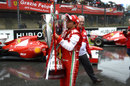 Felipe Massa kisses a 1.2 metre trophy presented to him by Ferrari to celebrate his career at the team