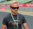 Heikki Kovalainen walks the track 