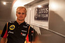 Heikki Kovalainen poses in Lotus kit
