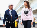 Bernie Ecclestone arrives in the paddock with his wife Fabiana Flosi