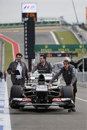 Sauber mechanics return Nico Hulkenberg's car from scrutineering