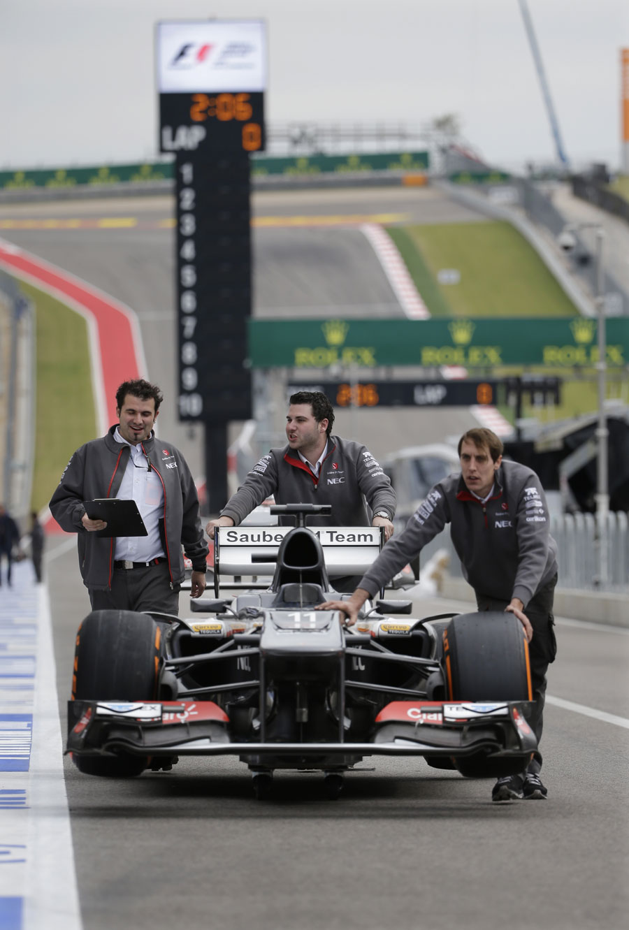 Sauber mechanics return Nico Hulkenberg's car from scrutineering