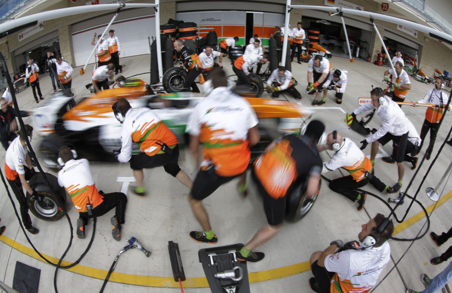 Force India carries out a pit stop drill on Thursday evening