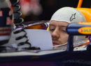 Sebastian Vettel studies telemetry in his Red Bull