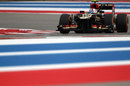 Romain Grosjean attacks the track in his Lotus