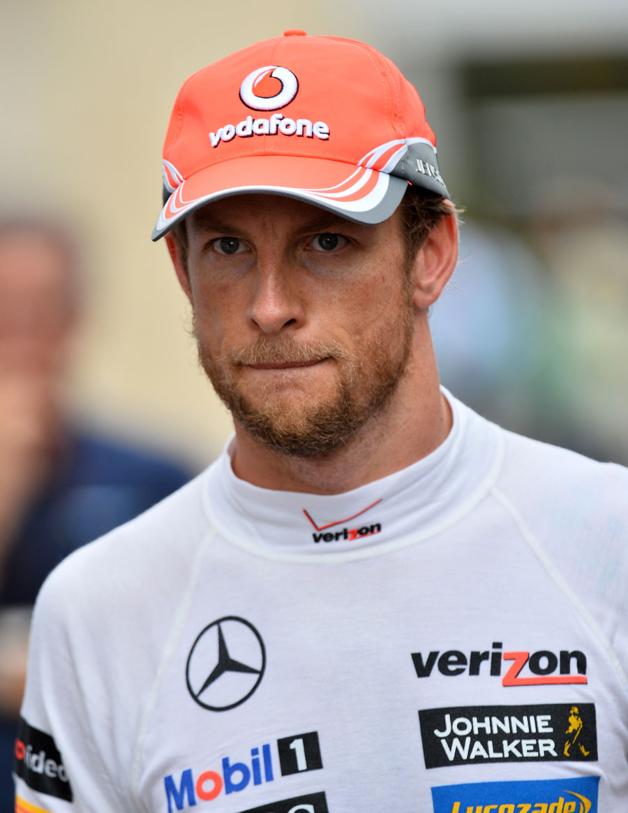 Jenson Button walks through the paddock