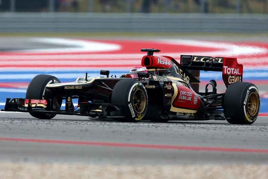 Heikki Kovalainen gets the power down in his Lotus