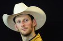 Romain Grosjean wears a cowboy hat in the post-race press conference