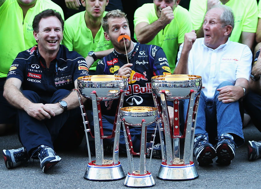Sebastian Vettel celebrates victory with a fake moustache, much to Helmut Marko's delight