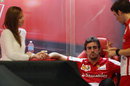 Fernando Alonso in the Ferrari garage with girlfriend Dasha Kapustina 