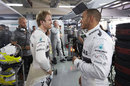Lewis Hamilton and Nico Rosberg laugh in the Mercedes garage
