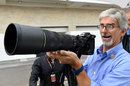 Damon Hill plays around with a camera in the paddock