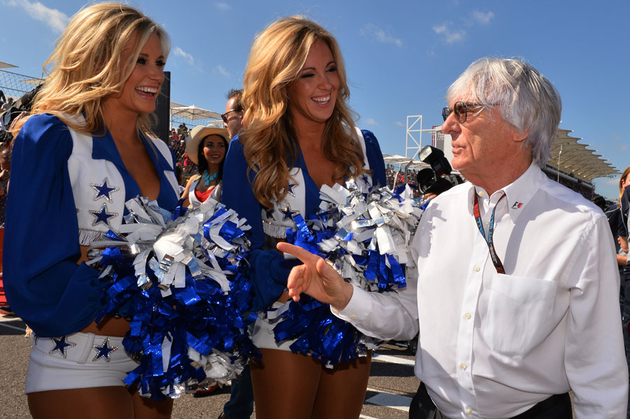 Bernie Ecclestone chats to Dallas Cowboys cheerleaders on the grid
