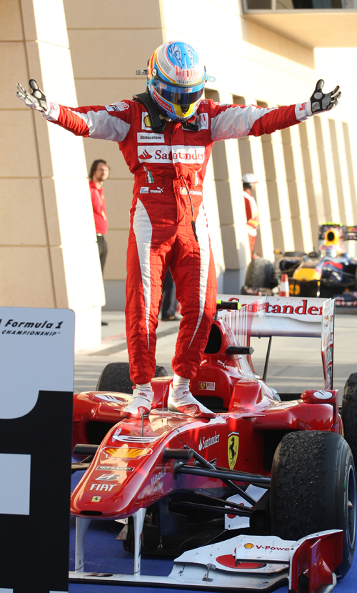 A delighted Fernando Alonso climbs from his car