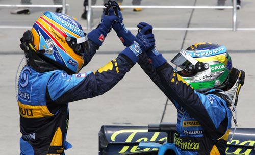 Second placed Fernando Alonso and race winner Giancarlo Fisichella 