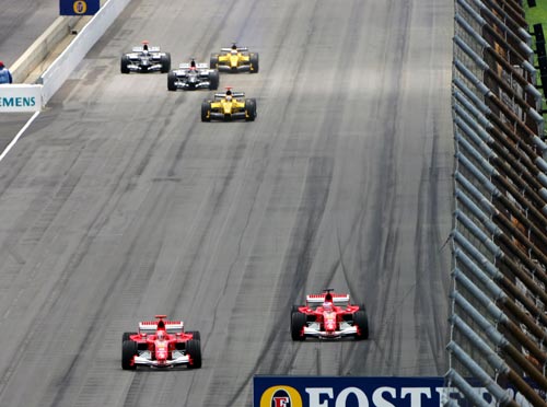 Michael Schumacher leads at the start of the 2005 US Grand Prix